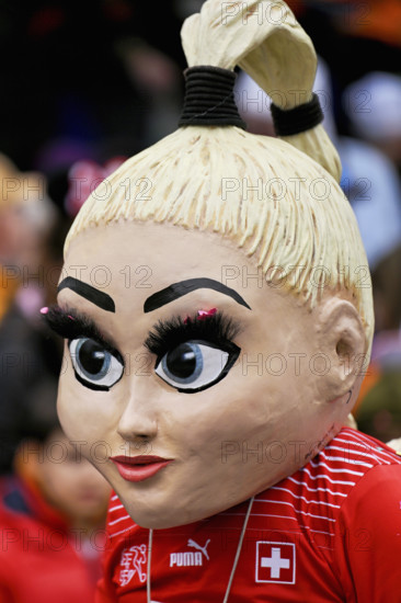 Person masked as footballer Alisha Lehmann at the carnival parade of the Wey guild on Rose Monday,