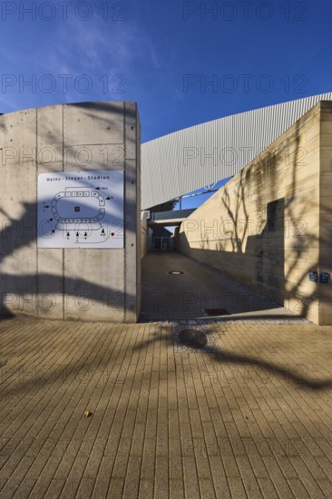 Heinz-Steyer-Stadion, stadium, side entrance, location board, concrete building, deep blue sky with