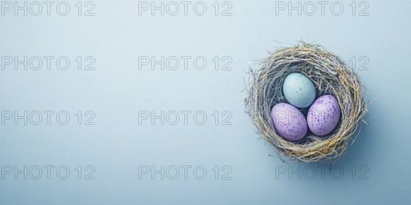 Small easter nest with purple painted eggs on blue background with copy space. Generative AI, AI