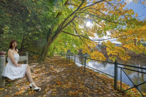 Autumn at the flower wall with model on bench in Rinteln Germany