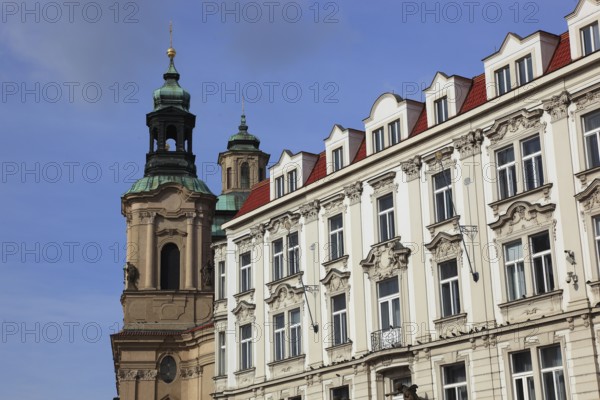 Historic houses and church tower of St Nicholas Church on Old Town Square, Prague, Czech Republic,