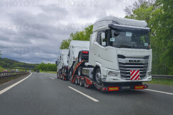 Car transporter loaded with brand-new lorries on the A6 motorway, Bavaria, Germany, Europe