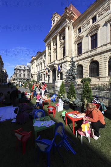 In the centre, event for children in front of the National Bank building on Lipscani Street,