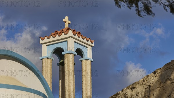 Saint Filimon church, detail of the church towers with a cross, blue sky in the background,
