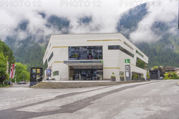 Modern building with large window front in foggy weather in the Alps, Mayrhofen, Zillertal,