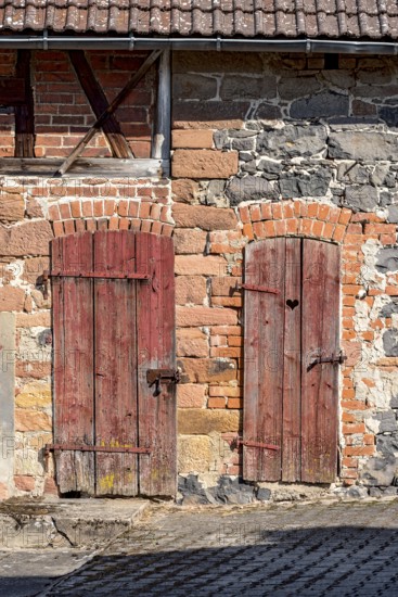 Historic farmhouse around 1800, half-timbered façade, sandstone, natural stone, brick, weathered