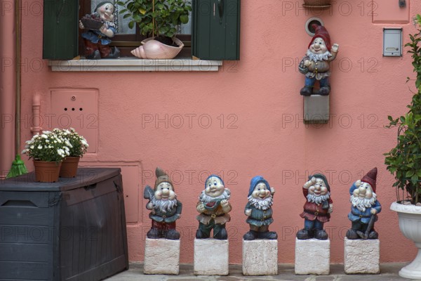 Garden gnomes in front of a house, Burano, Veneto, Italy, Europe