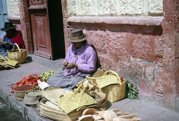 Indigenous market traders on the street, Ambato market, Ecuador, South America, 1962, South America