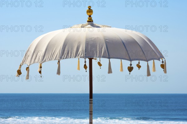 Traditional Balinese temple sunshade as parasol, sun, Hinduism, symbol, beach holiday, protection,