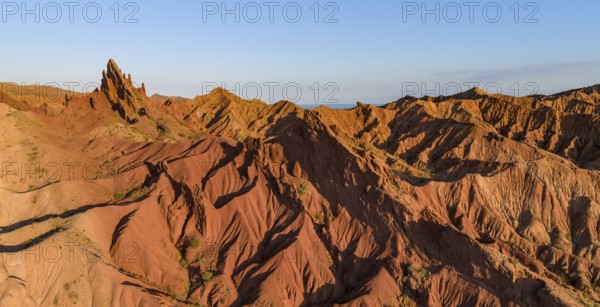 Aerial view, eroded mountain landscape, sandstone cliffs, canyon with red and orange rock