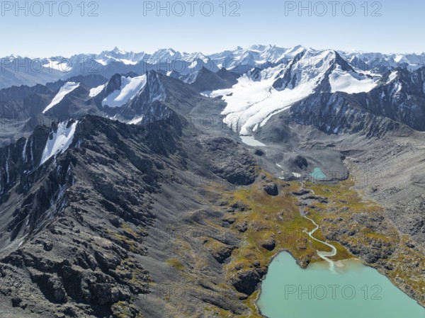 Mountain panorama, aerial view, 4000 metre peak with glacier, mountain pass and mountain lake