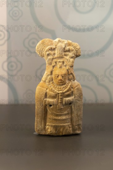 Ceramic figurine model of woman with mantle cloak, from Jaina, Late classical period, Mayan