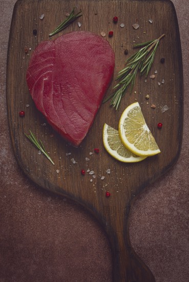 Fresh red tuna fillet, for steak, raw, top view, on a cutting board, no people