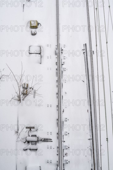Onset of winter with lots of fresh snow and temperatures below -5 degrees during the day, railway