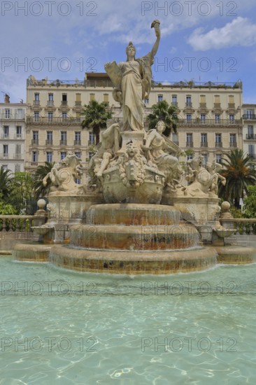 Sculptures at the Fontaine de la Fédération built in 1890, Palm trees and Grand Hotel, Statue of