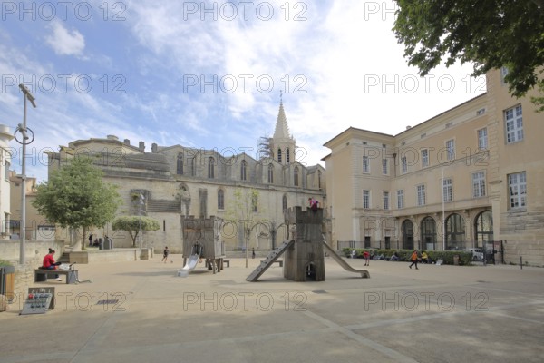 Romanesque church of St-Siffrein and children's playground, Saint, Carpentras, Vaucluse, Provence,
