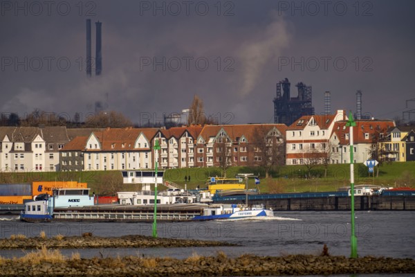 The river Rhine near Duisburg, houses on the Rhine dyke, Laar district, Thyssenkrupp Steel