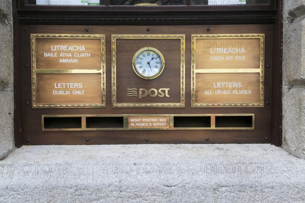 Letter boxes and clock outside the General Post Office, O' Connell Street, Dublin city centre,