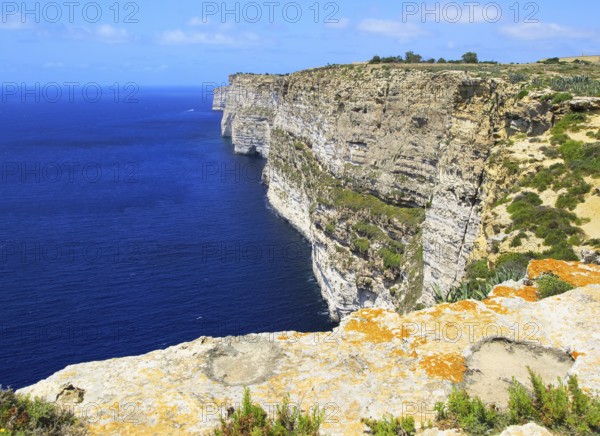 Coastal clifftop landscape view westwards at Ta' Cenc cliffs, island of Gozo, Malta, Europe