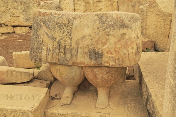 Tarxien neolithic megalithic prehistoric temple complex site, Malta, statue of skirt and legs of