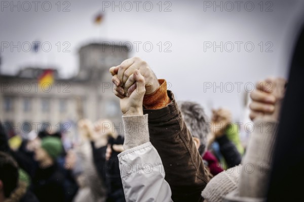 People hold hands at the large demonstration against the right in Berlin under the slogan We are