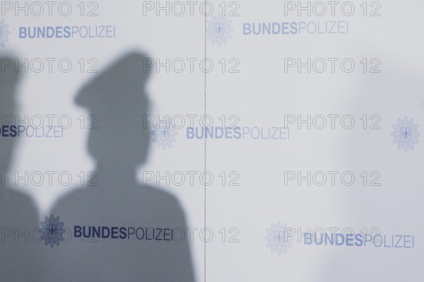 The shadow of a policewoman, taken as part of a press statement on the occasion of the opening of