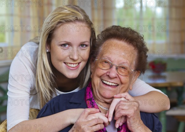 A grandson visits his grandmother Fun and joy while hugging, Vienna, Austria, Europe