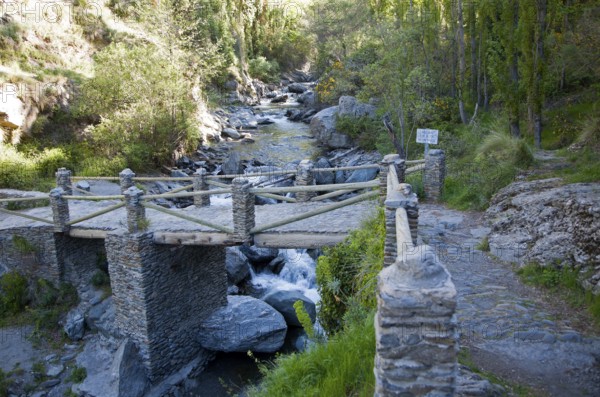Bridge crossing the River Rio Poqueira gorge valley, High Alpujarras, Sierra Nevada, Granada