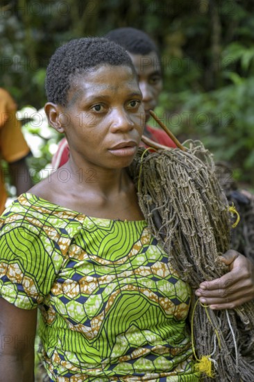 Pygmy woman of the Baka or BaAka people with her hunting net, Dzanga-Sangha Special Dense Forest