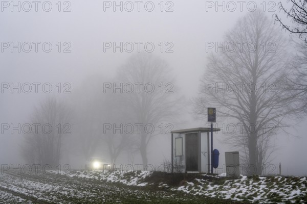 Dense fog, with visibility partly below 100 metres, country road, bus stop Am Treppchen,