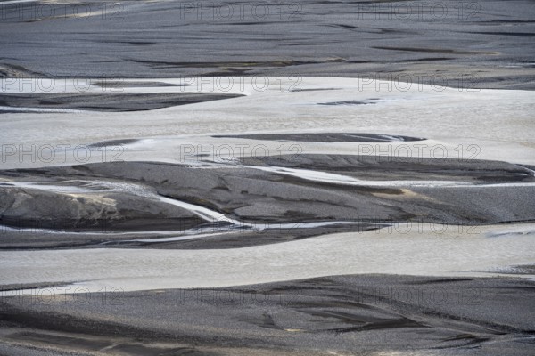 Detail, structure, river course in a gravel bed with black sand, meandering river, Dímonarhellir,