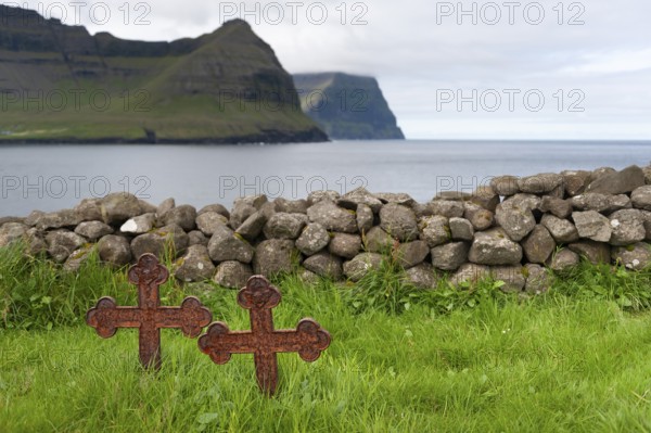 Old iron crosses, stone wall, cemetery, Vidareidi, Vidoy Island, Viðareiði, Viðoy Island, Faroe