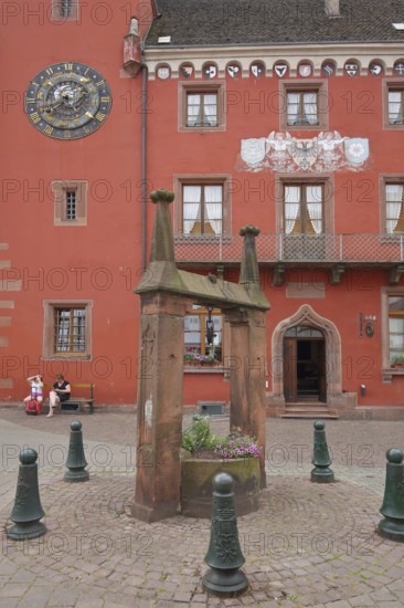 Entrance to the late Gothic Alsatian Museum with astronomical clock and historic drawing fountain,