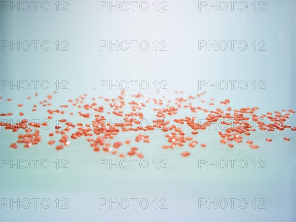 Red-coloured rock candy as a sprinkle decoration for decorating ice cream, cakes and muffins,