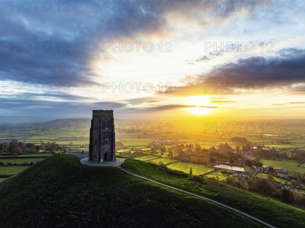 Sunrise over Glastonbury Tor from a drone at autumn, Glastonbury, Somerset, England, United