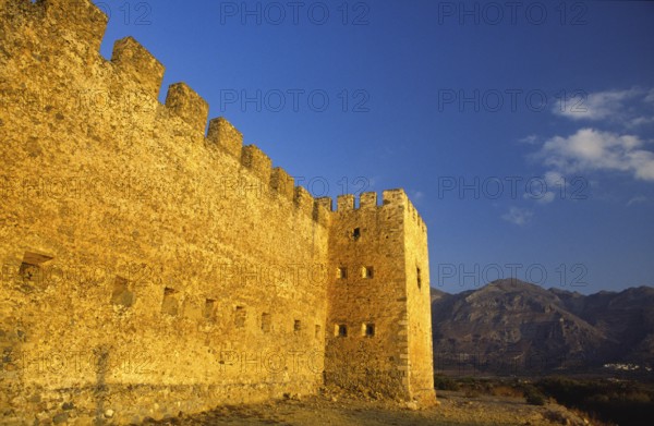 Scan, side view, fortification wall, embrasures, battlements, tower, mountains, blue sky, single