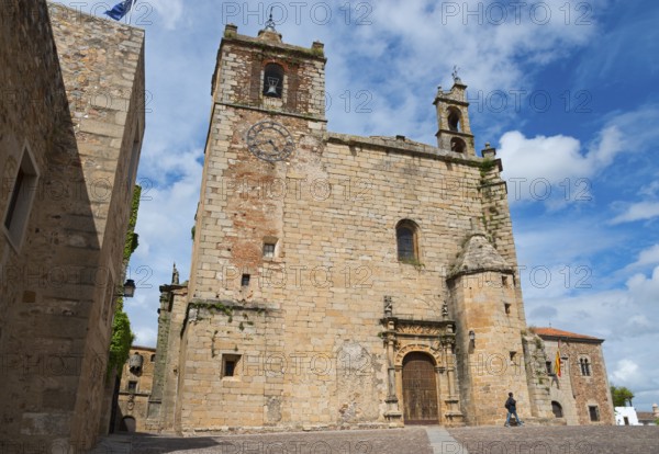 Historic church with ornate bell towers under a blue sky, Iglesia de San Mateo, Old Town,