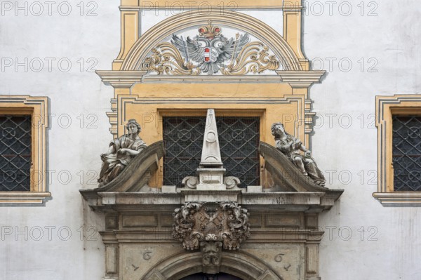 Detailed view of the entrance portal with the Alegories of Faith and Peace of the Baroque Town Hall