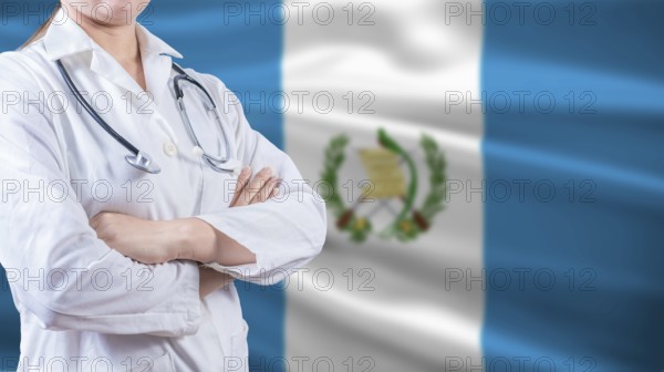 Healthcare concept with Guatemalan flag in background. Doctor with arms crossed with Guatemala flag