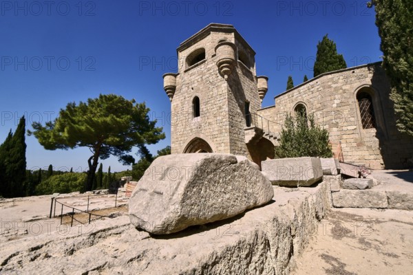 Monastery of Our Lady of Mount Filerimos, A medieval stone tower on a sunny day surrounded by