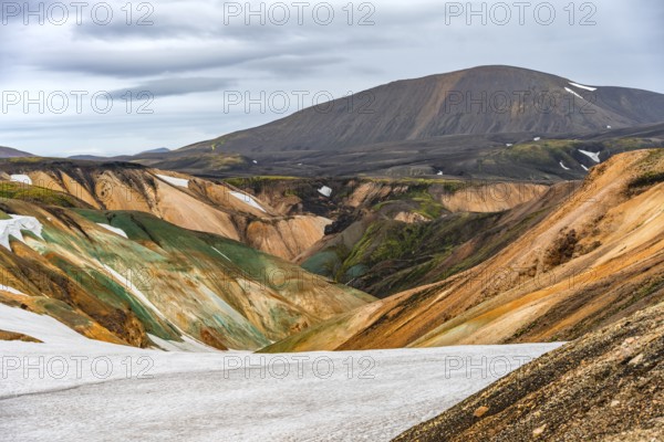 Colourful volcanic landscape with hills and snow, Laugavegur trekking trail, Landmannalaugar,
