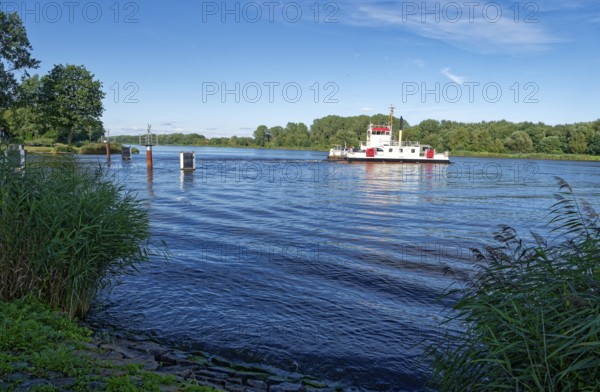 The Burg canal ferry crosses the Kiel Canal. Burg, Schleswig-Holstein, Germany, Europe