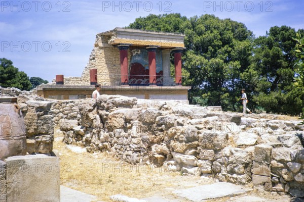 Tourists visiting Bronze Age Minoan archaeological site of Knossos, Crete, Greece, Europe 1968,