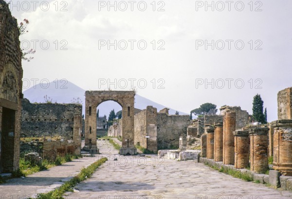 Roman ruins Archaeological Park of Pompeii, Naples, Italy, Europe 1967 with Mount Vesuvius volcano