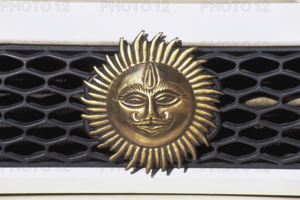 Emblem of sun on car dash, Mumbai, India, Asia