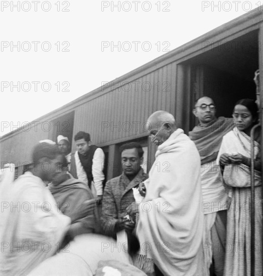 Mahatma Gandhi collecting funds for untouchables at a train station on his way to Assam - MODEL