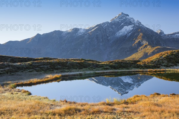 Piz Beverin and mountain lake, Grisons, Switzerland, Europe