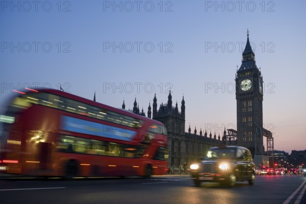 Red double-decker bus on Westminster Bridge, blue hour, Big Ben in the background, Westminster,