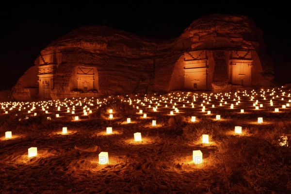 Illuminated Nabataean tombs at night, Hegra or Mada'in Salih, AlUla region, Medina province, Saudi