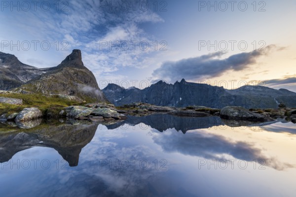 Romsdalshornet mountain reflected in mountain lake, Åndalsnes, Møre og Romsdal, Norway, Europe